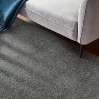 A Roll of Area Rug Featuring Peel-And-Stick Carpeting That Has a Self-Adhesive, Non-Slip Surface